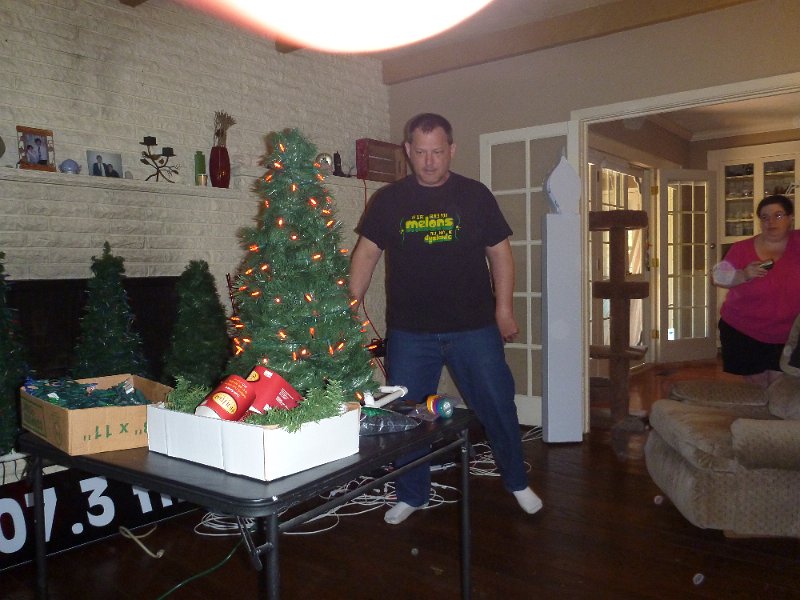 P1000165.JPG - John with his version of the mini-tree adding lights